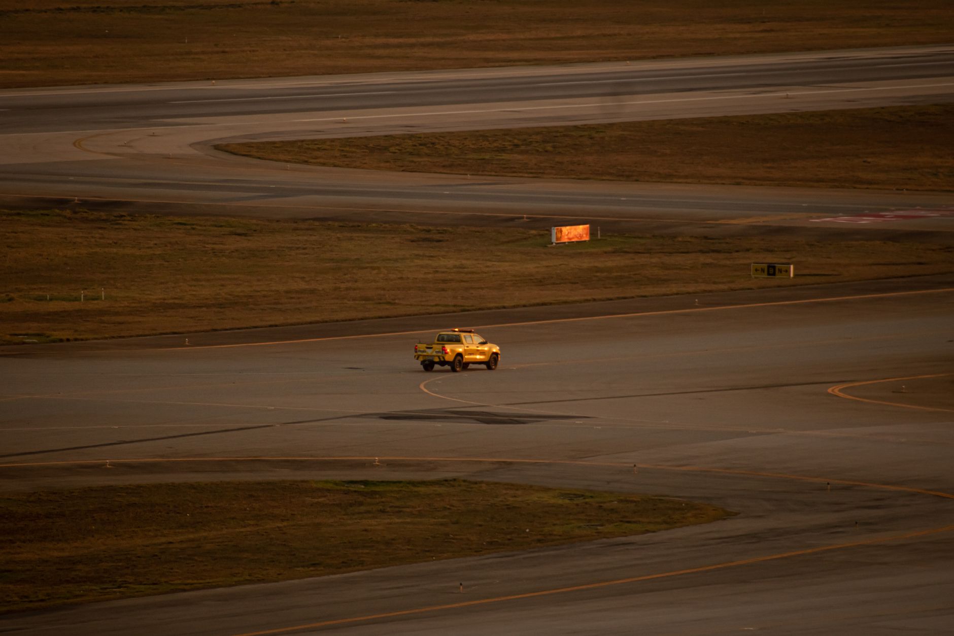 Greenfield airport runway under an open sky